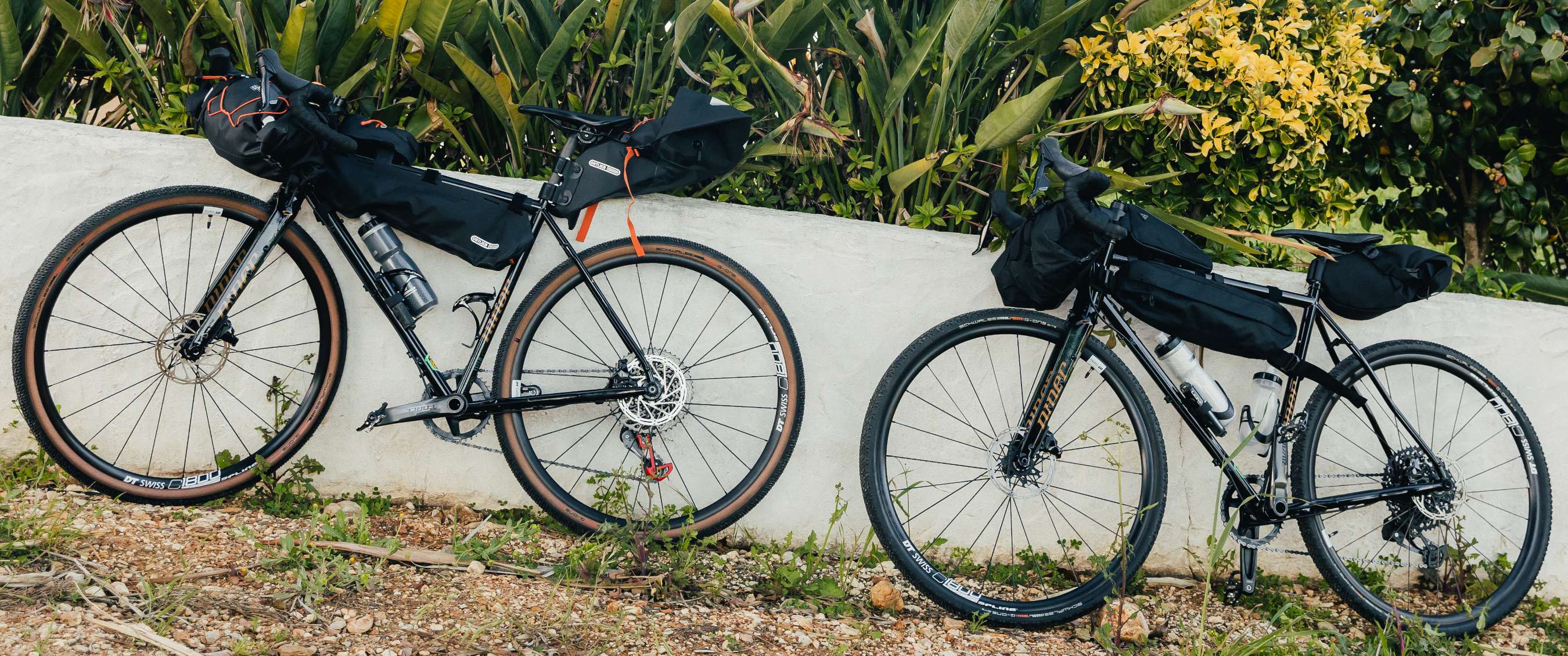 Man relaxing near his tent and bike