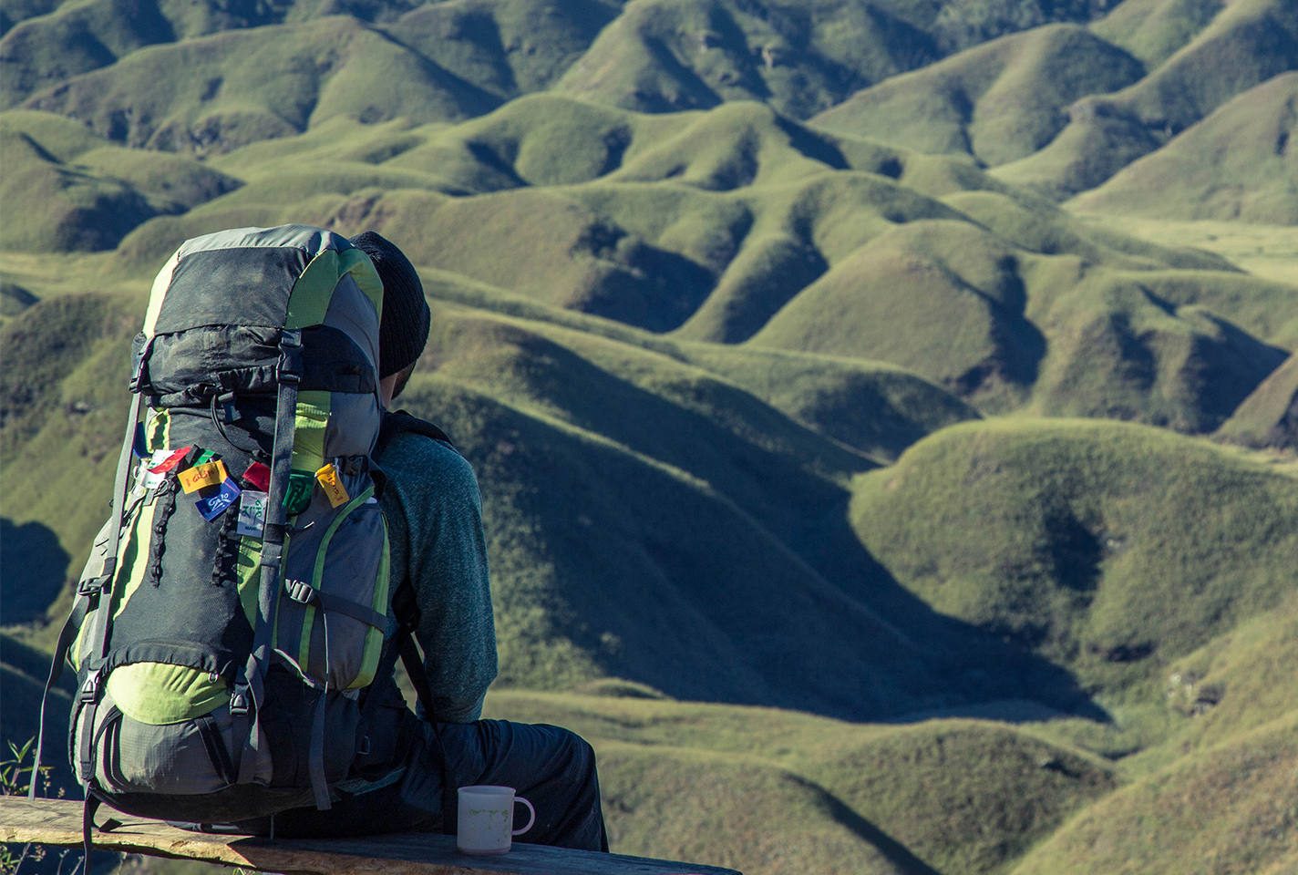woman hiking wearing a blue rucksack