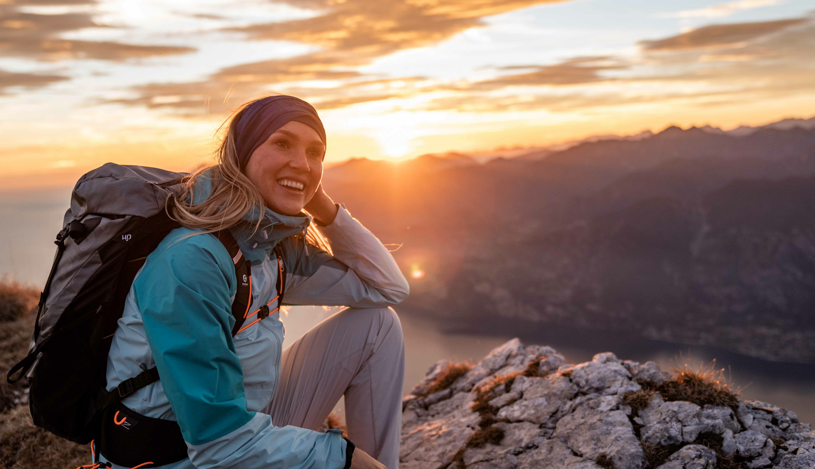 Woman wearing a blue lightweight waterproof jacket