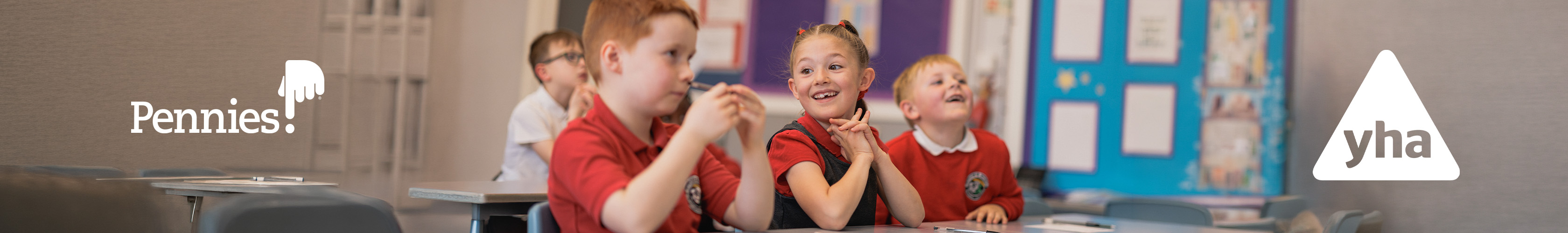 No Child Left Behind x Pennies. A group of children sitting in a clasroom
