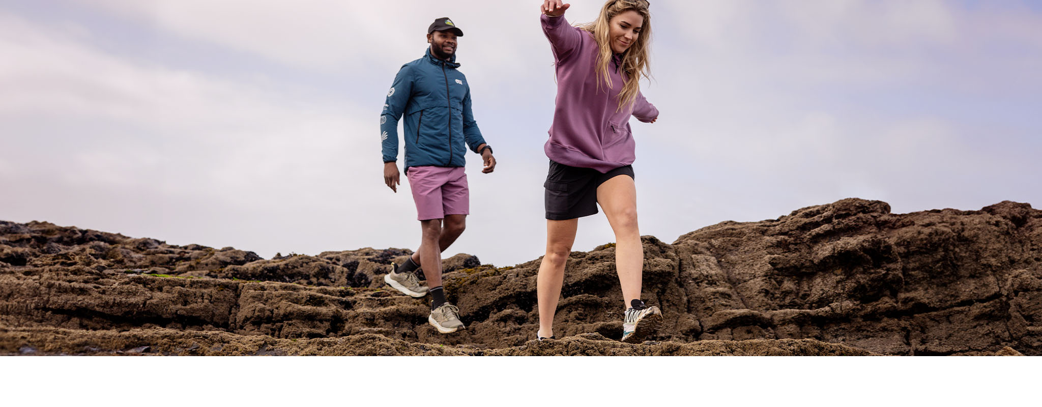 Two people wearing walking shoes on a hike 