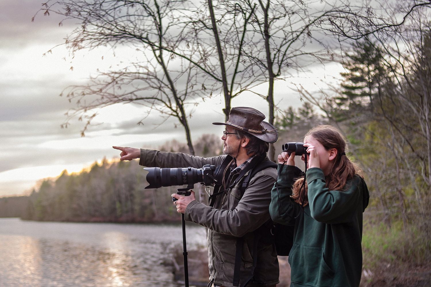 Man pointing at birds nearby