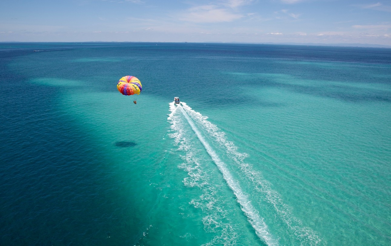 A person parasailing over the sea 
