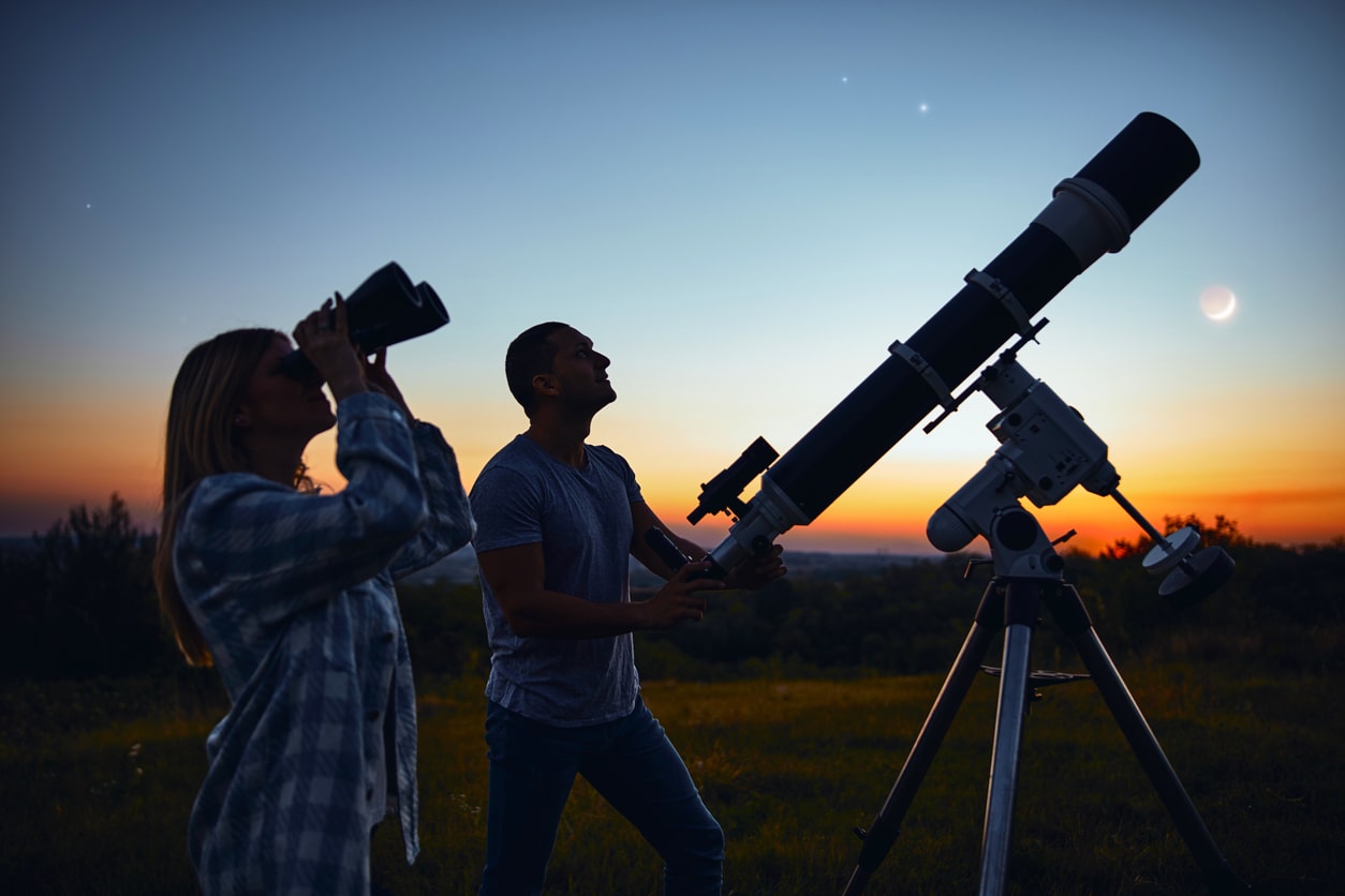 Couple using a. Telescope