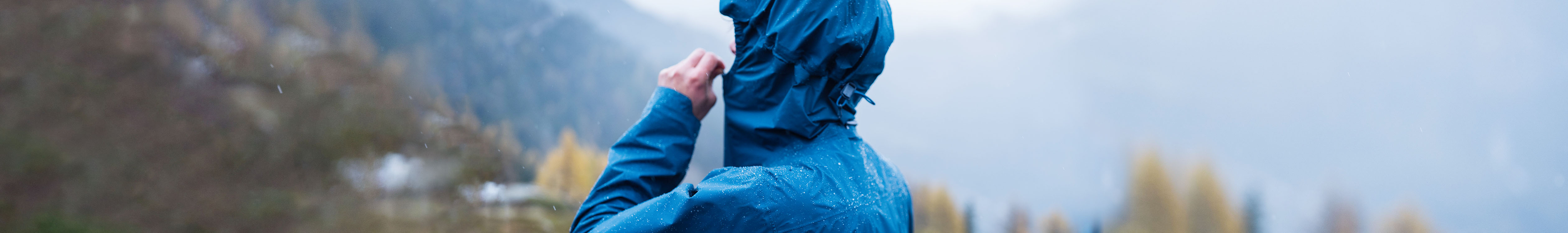 Women wearing a blue waterproof jacket