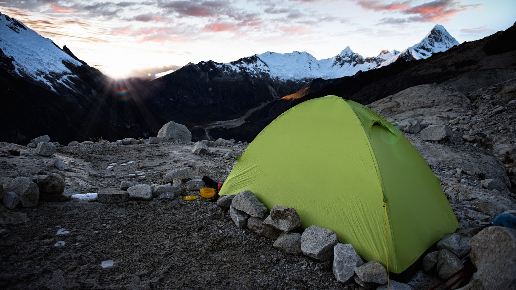 Green tent in the mountains