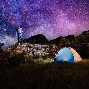 Man having his coffe inside his tent