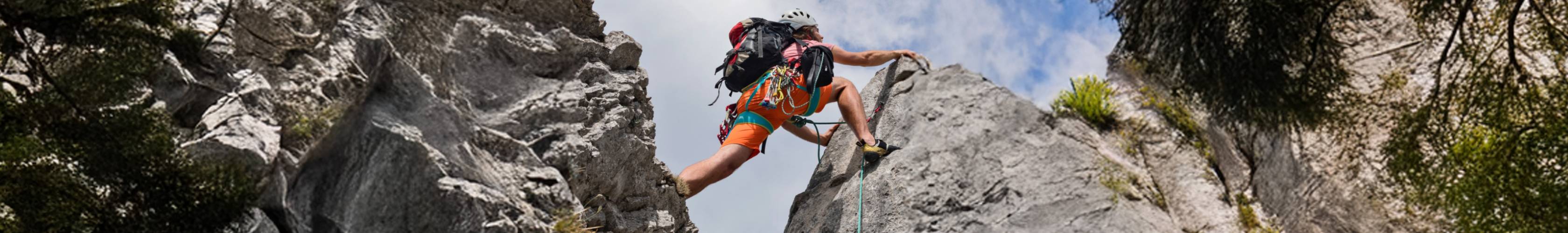 Woman climbing a rock